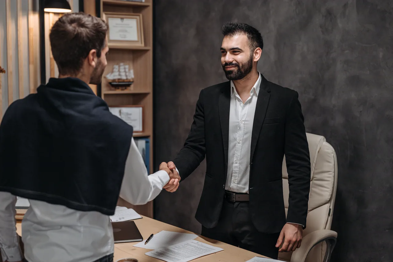 A lawyer meeting a client in his office